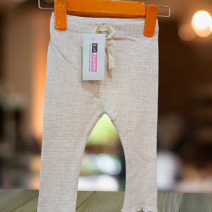 Off-white cotton dotted tights for girls, imported quality, available at Kids Republic Peshawar.
